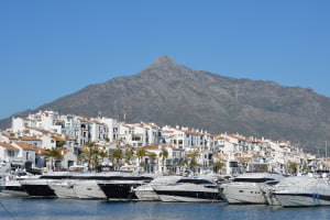 puerto banus port with yachts and apartments
