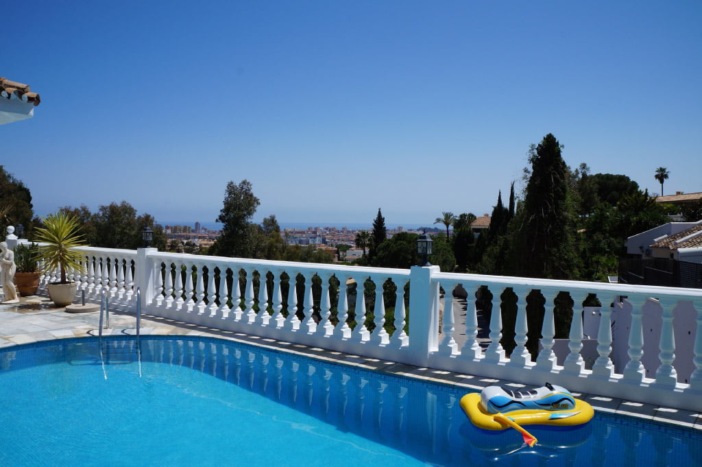 villa with a pool overlooking the sea