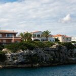 Whitewashed Mediterranean villas on the Spanish coastline — buying property in Spain as a UK citizen in 2026