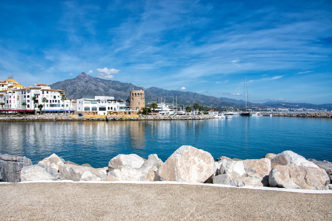 Estepona marina with white buildings and La Concha mountain backdrop on the Costa del Sol
