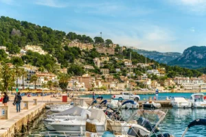 Puerto de la Duquesa marina with yachts and Spanish hillside village - Casares Costa property guide for British buyers