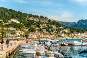 Puerto de la Duquesa marina with yachts and Spanish hillside village - Casares Costa property guide for British buyers