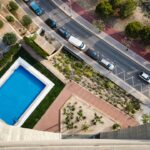 Communal swimming pool in a Spanish apartment complex on the Costa del Sol, illustrating community fees