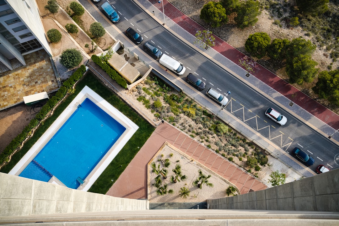 Communal swimming pool in a Spanish apartment complex on the Costa del Sol, illustrating community fees