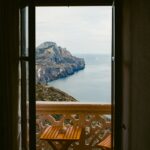 Balcony with table and chairs overlooking the Mediterranean sea — retiring to Spain from the UK