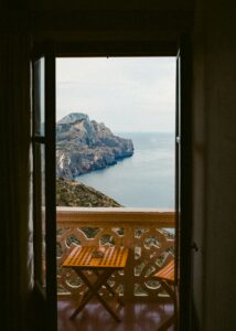 Balcony with table and chairs overlooking the Mediterranean sea — retiring to Spain from the UK