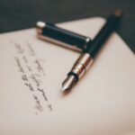 Fountain pen resting on cream stationery, ready to sign a Spanish will for a British property owner