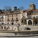 Sunny Spanish plaza surrounded by historic buildings — opening a bank account in Spain as a British non-resident