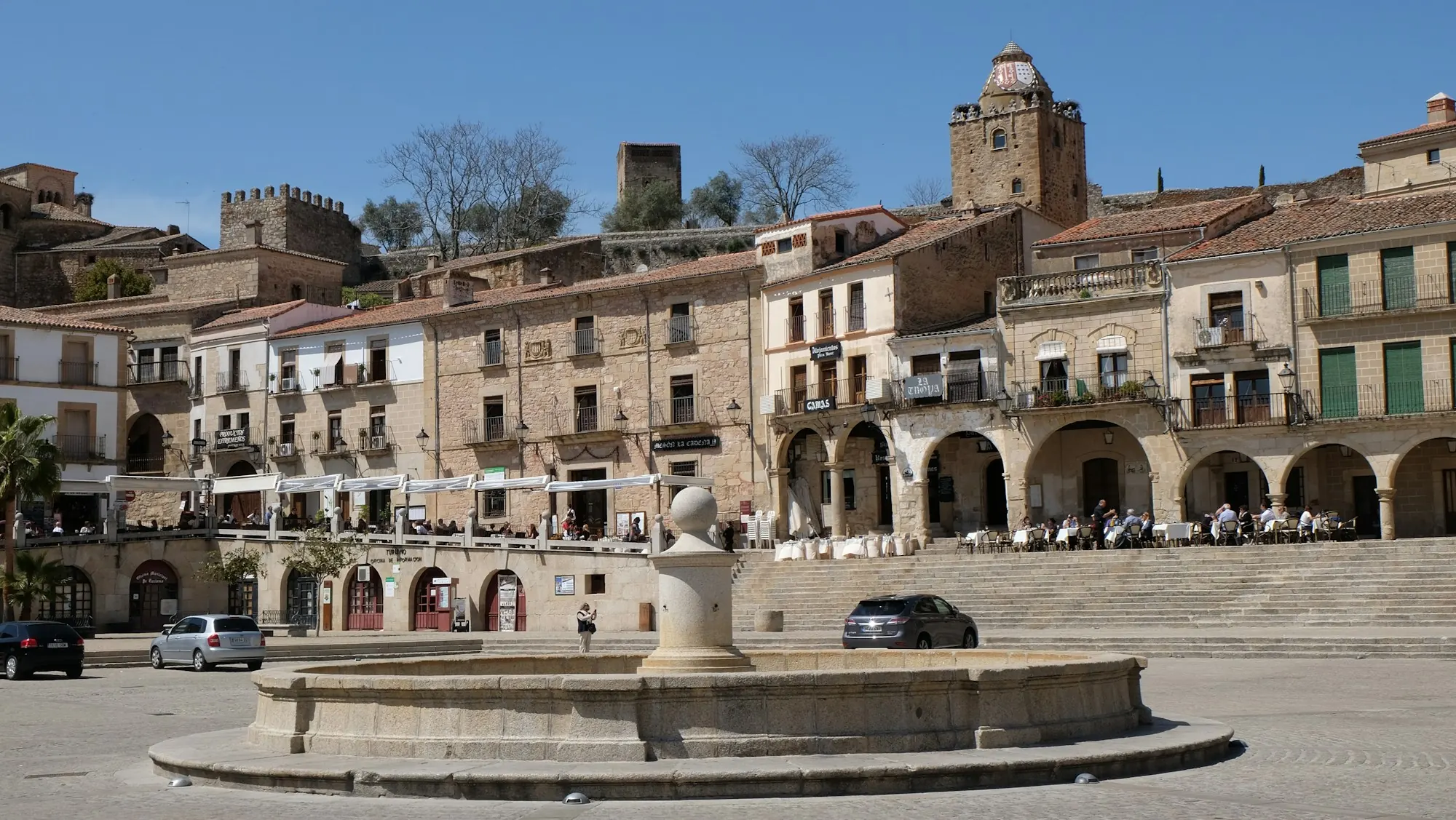 Sunny Spanish plaza surrounded by historic buildings — opening a bank account in Spain as a British non-resident