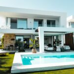 Mediterranean villa with pool on the Costa del Sol representing the choice between a holiday home and a permanent move to Spain