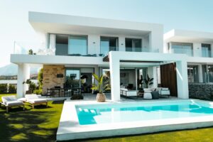 Mediterranean villa with pool on the Costa del Sol representing the choice between a holiday home and a permanent move to Spain