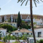 White houses and palm trees on the Costa del Sol — Spanish property purchase tax guide for UK buyers 2026