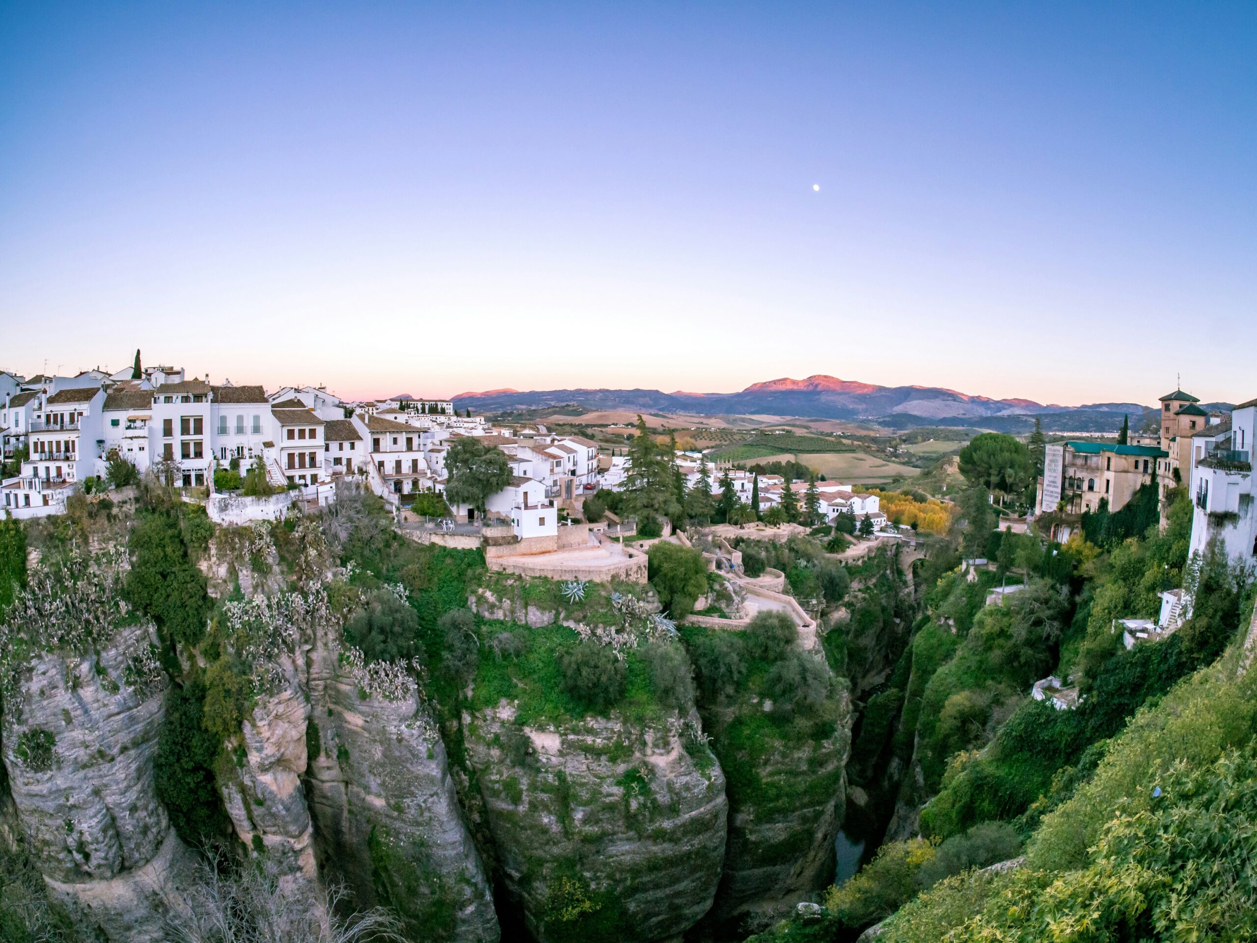 A whitewashed Andalusian town with the local Ayuntamiento in the foreground, representing empadronamiento and the Spanish municipal register